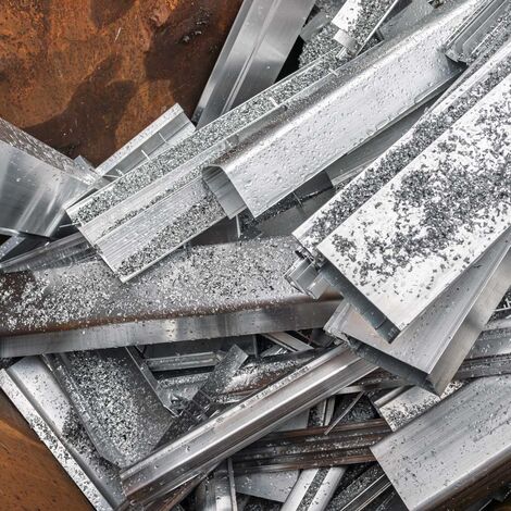 Aluminium scrap profiles in brown container.