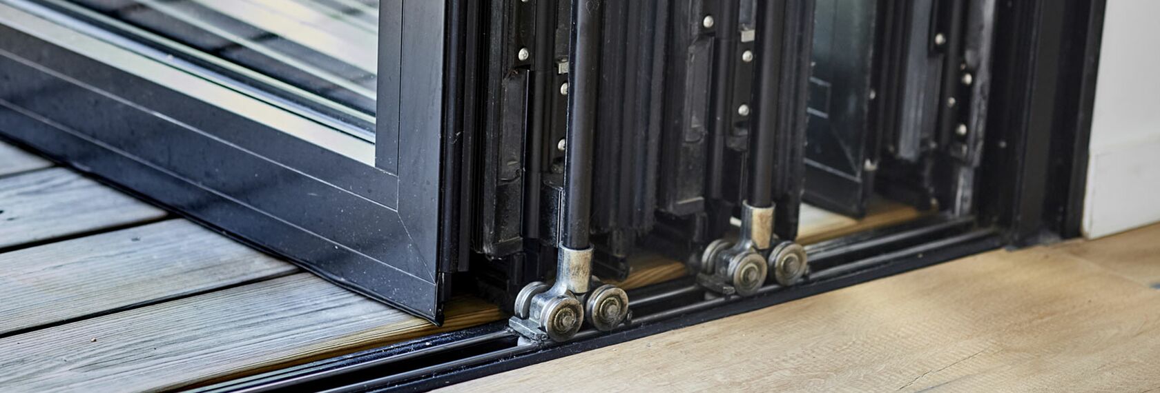 Close-up of sliding components of a folding door solution