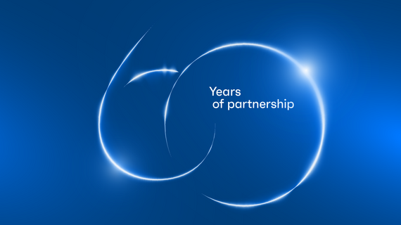 60 years of partnership visual on blue background